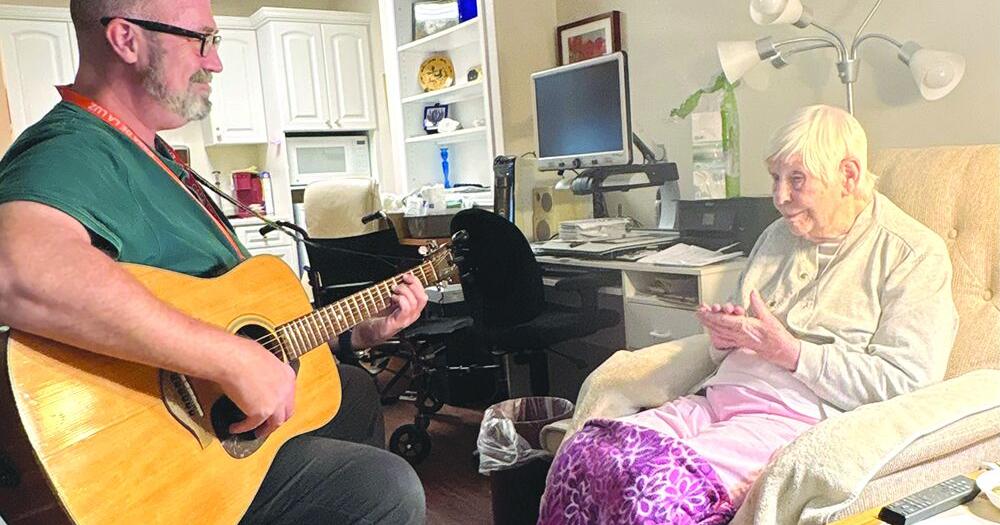 Have Guitar, Will Travel: Music therapist brings comfort 