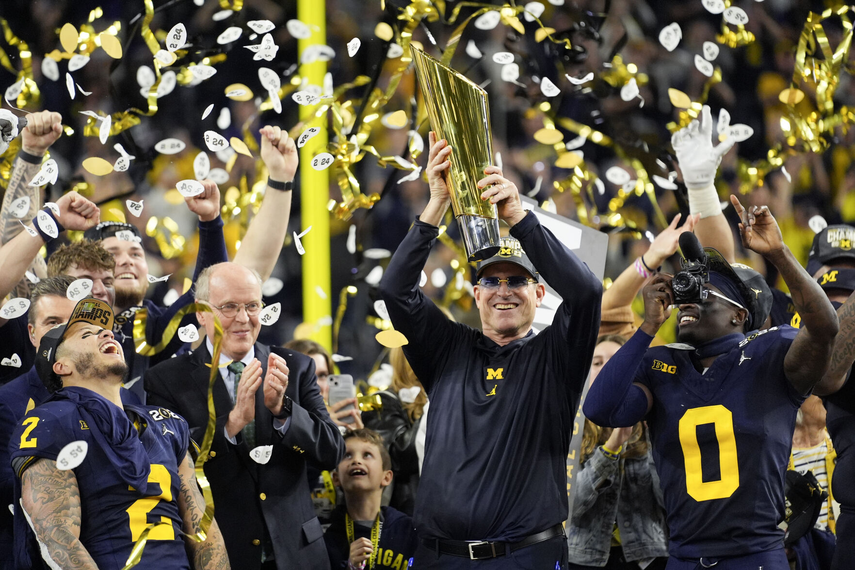 Jim Harbaugh delivers a national title. Corum scores 2 TDs