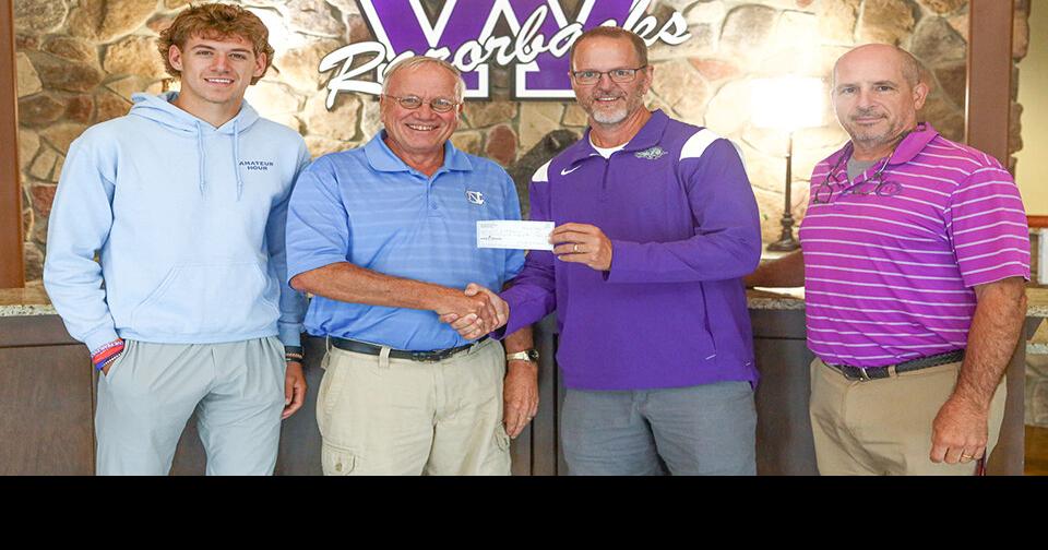 Local presents another check to Walhalla golf team from ball sale