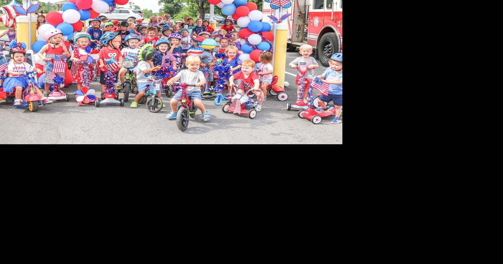 Children celebrate with red, white and blue bikes, firefighters | News
