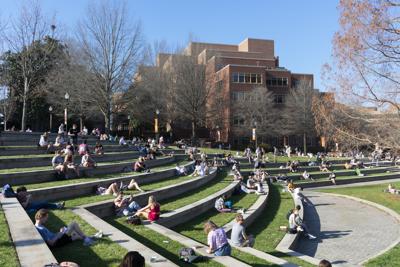 Students sitting outside in spring