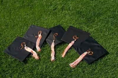 Graduation caps in grass
