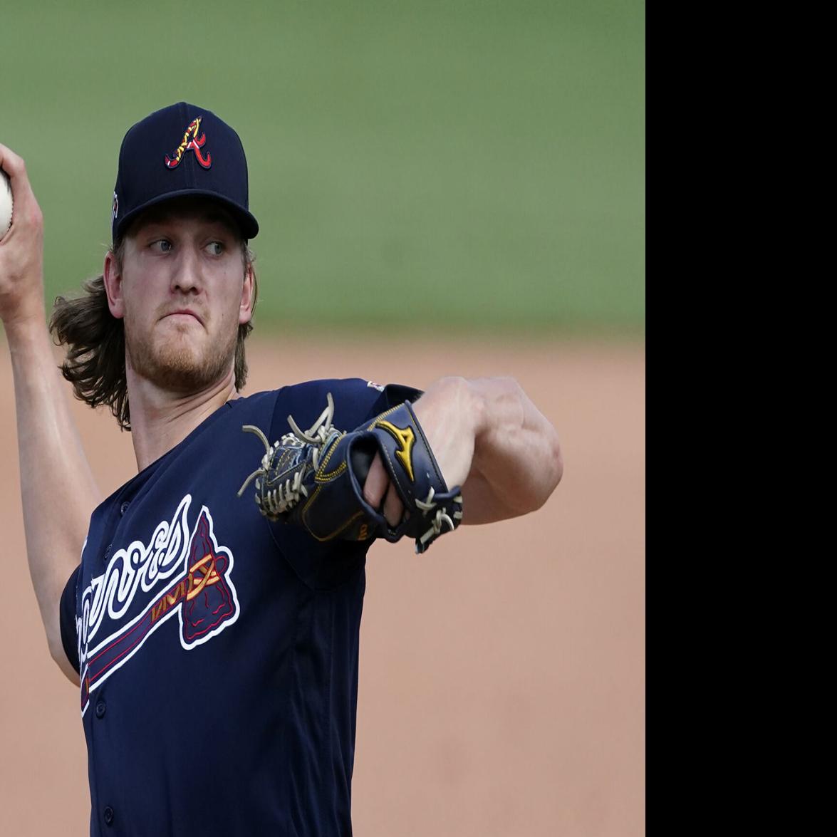 Spencer Strider of the Atlanta Braves talks with Mike Soroka of