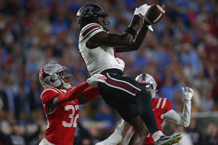Nov 1, 2025; Oxford, Mississippi, USA; South Carolina Gamecocks wide receiver Nyck Harbor (8) attempts to catch a pass as Mississippi Rebels defensive back Chris Graves Jr. (32) defends during the first quarter at Vaught-Hemingway Stadium. Mandatory Credit