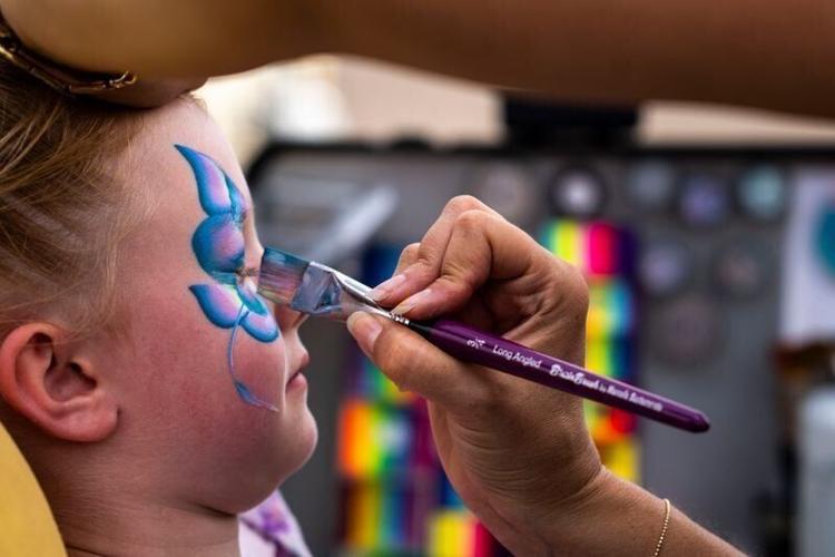 Amaya Anderson of Des Moines has her face painted like a butterfly during Ingersoll Live on Saturday, Aug. 24, 2024, in Des Moines.