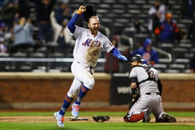 Pete Alonso of the New York Mets celebrates after scoring the game-winning run in the bottom of the 10th inning against the Arizona Diamondbacks at Citi Field in New York on Friday, May 7, 2021.
