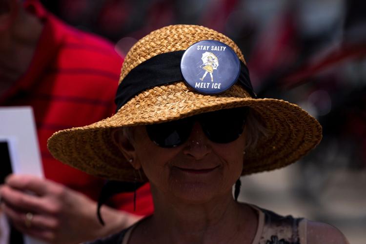 Pam Rosengard wears a button while protesting Immigration and Customs Enforcement agency outside of Great American Ball Park in