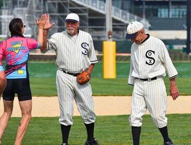 Members of the Field of Dreams Ghost Players play with members of the RAGBRAI route inspection crew in Dyersville on June 6, 2026.