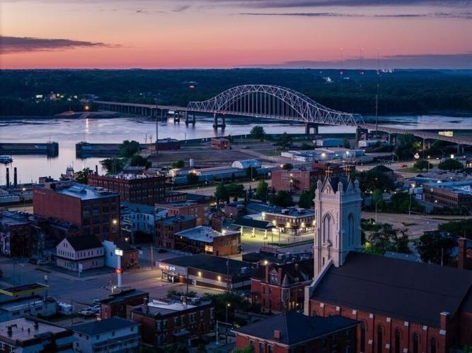 A pre-dawn glow turns the sky over Dubuque pink, June 15, 2026.