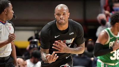 Miami Heat’ s P.J. Tucker displays three fingers after hitting a 3- point shot against the Boston Celtics during the first half on Thursday, Nov. 4, 2021.