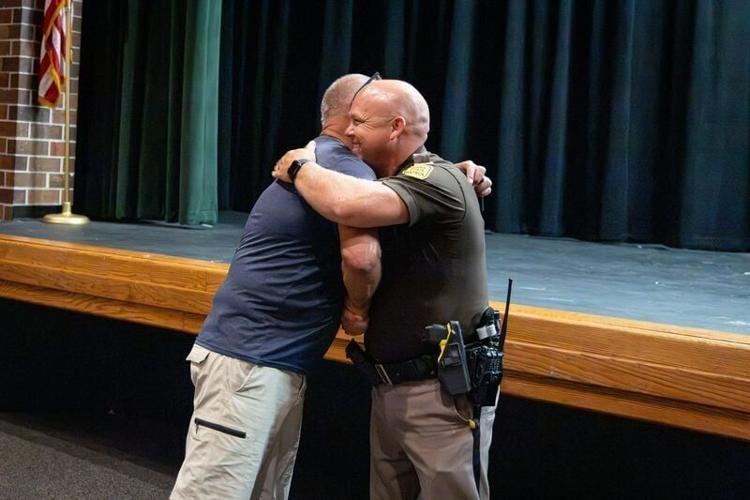 Tait Williams meets up with Iowa State Trooper Darren Flaherty, who saved his life during RAGBARI 2025, during a rider meeting for the 2026 ride.
