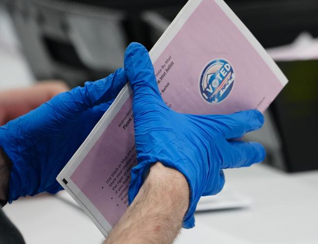 Election workers at the Washoe County (Nevada) Registrar of Voters office process ballots during the Feb. Presidential Primary Election. All 18 of the office's workers quit and had to be replaced between the 2020 election and the 2024 primary.