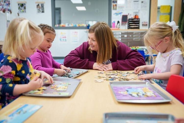 Emily Feldman, owner and director of Lakes Early Learning Center in Polk City, works with children ages 3 and 4 on April 3, 2026.