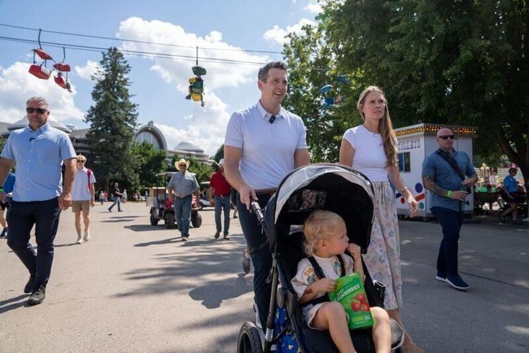 Zach Lahn and his wife Annie take their son Fritz to the Iowa State Fair, Thursday, August 20, 2026.