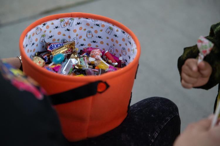 Church member Annette Ballard hands out candy at Second Baptist Church's Trunk or Treat in Corpus Christi, Texas, on Oct. 31, 2025.