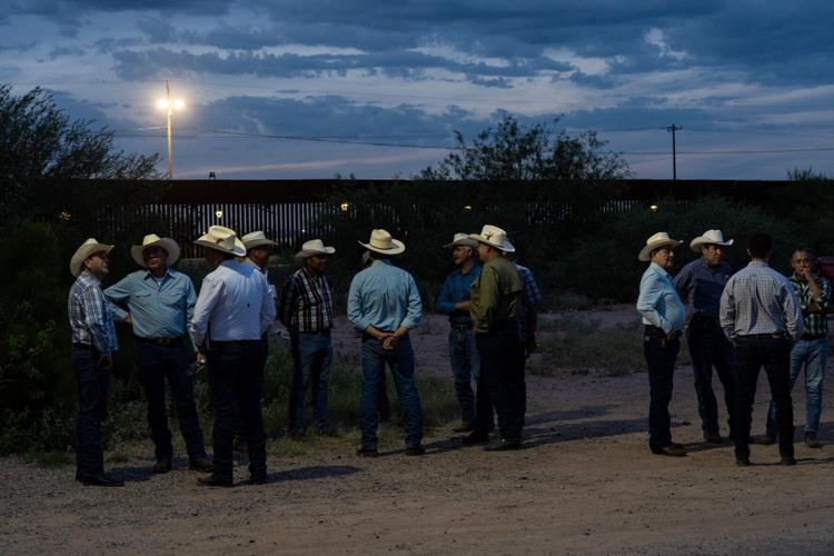 Members of the Unión Ganadera Regional de Sonora gather outside the organization's offices in Agua Prieta, Sonora, just feet from the U.S.-Mexico border wall on Aug. 23, 2026, ahead of the resumption of cattle exports to the United States. Ranchers and in