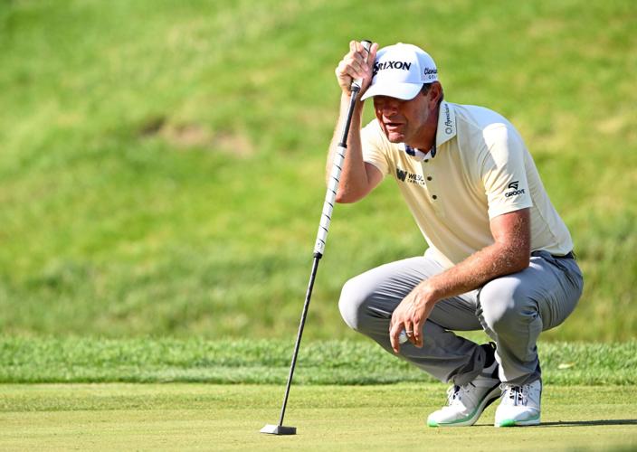 Lucas Glover lines up his putt on the 9th hole during the second round of the John Deere Classic golf tournament.