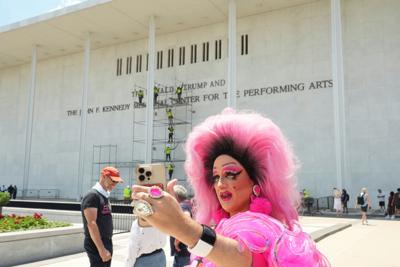 Lettering referencing U.S. President Donald Trump is removed from the facade of the John F. Kennedy Center for the Performing Arts, in Washington