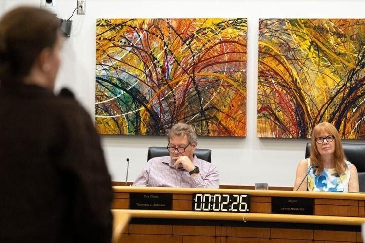 Mayor Laurie Goodrich, right, listens during public comment Aug. 25, 2026 during a Coralville City Council meeting in Coralville, Iowa.