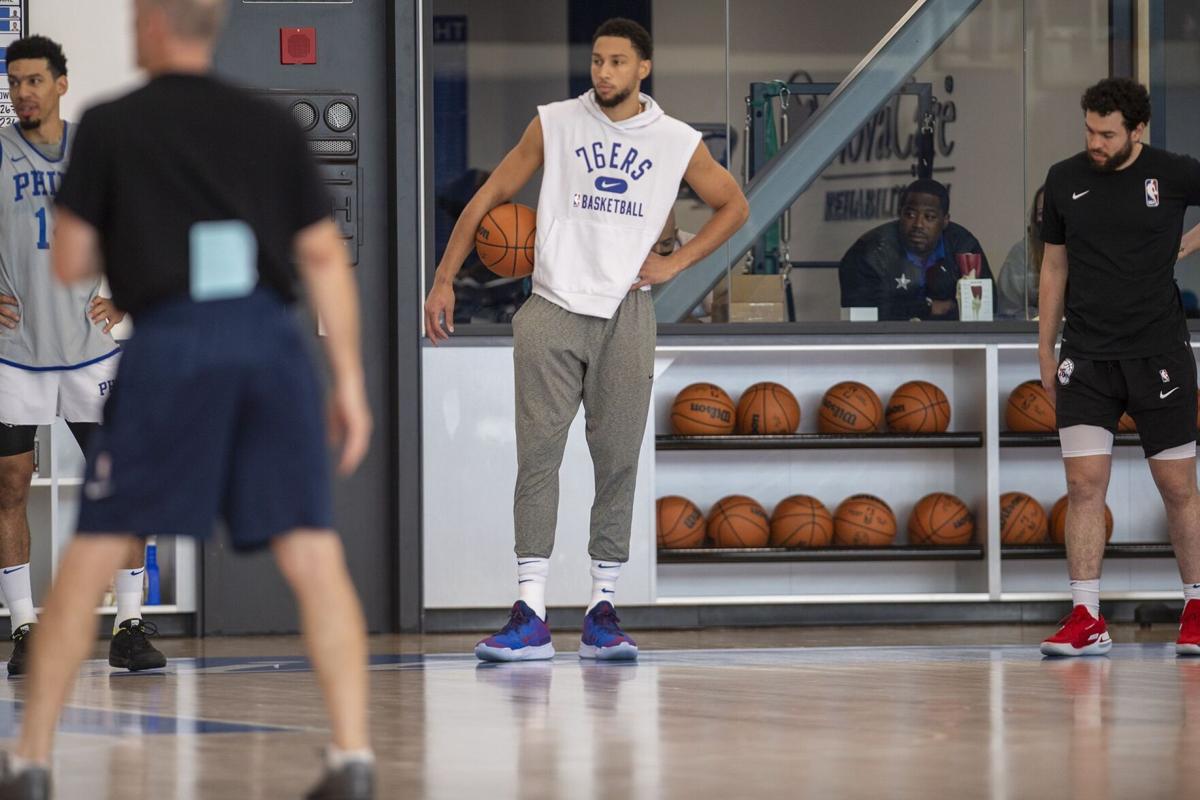 Ben Simmons, center, looks on during practice Monday, Oct. 18, 2021 at the Philadelphia 76 ers' practice facility.