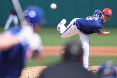 Starting pitcher Jacob Degrom of the Texas Rangers works against the Chicago Cubs during the second inning of a spring training game at Surprise Stadium on March 10, 2026, in Surprise, Arizona.