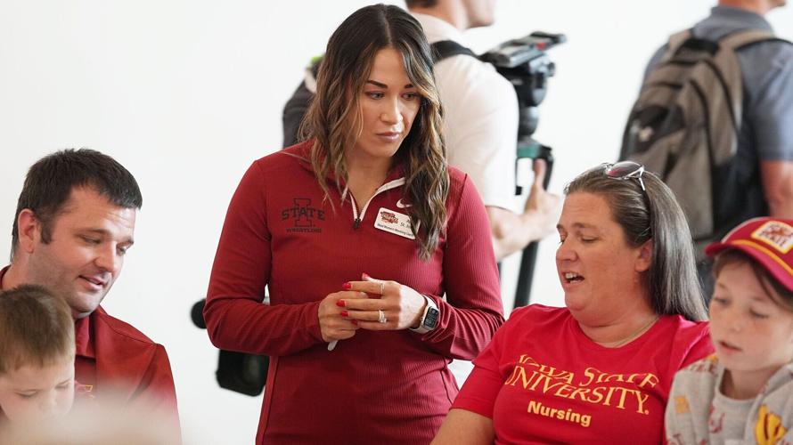 Iowa State women’s wrestling coach Alli St. John talks to fans during Cyclone Tailgate Tour at Curate on may 18, 2026, in Des