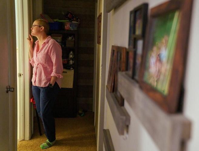 Victoria Means waits outside the bathroom as one of her 3 sons prepares for school Monday, Aug. 24, 2026 in Atlantic, Iowa.