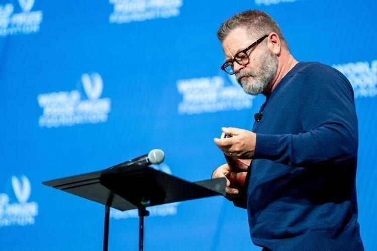 Actor Nick Offerman plays a song on a hand-made ukulele during a panel on regenerative farming at the Norman E. Borlaug International Dialogue hosted by the World Food Prize Foundation, Tuesday, October 20, 2026, at the Iowa Events Center in Des Moines.