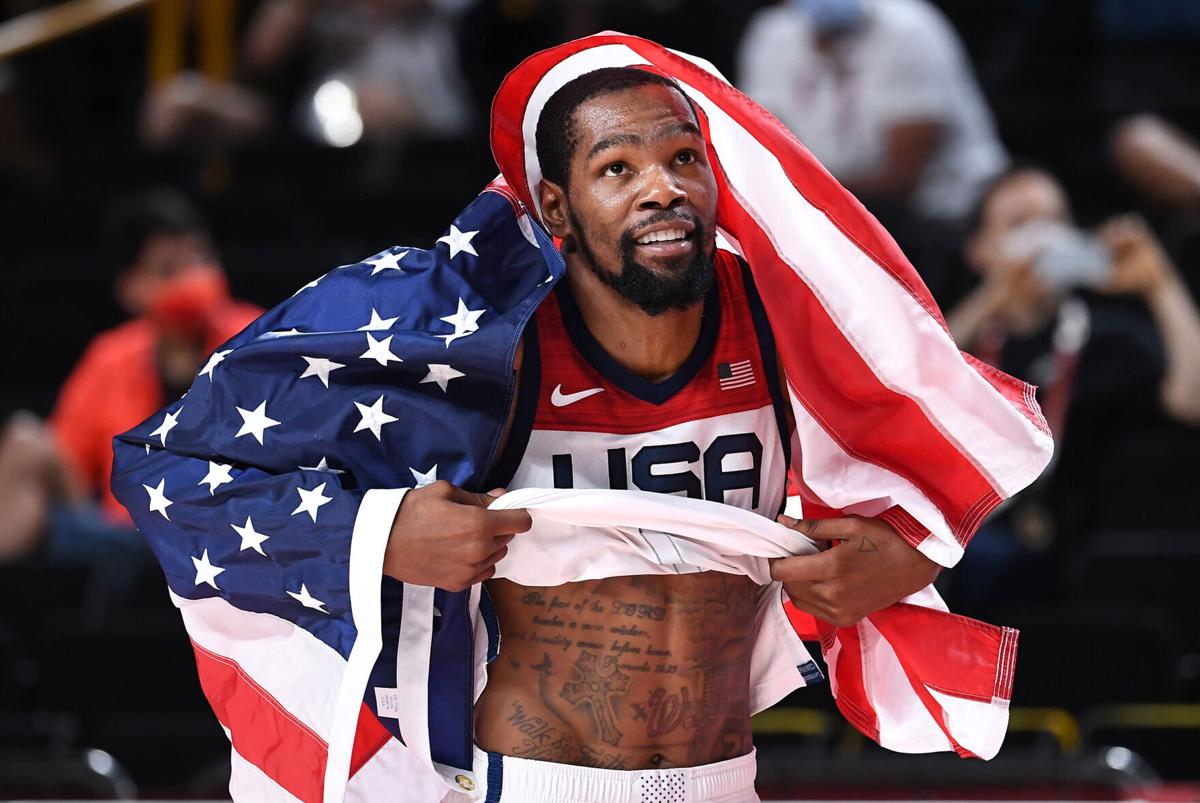 USA's Kevin Durant celebrates the gold medal after defeating France in the Men's Basketball Final at the 2020 Tokyo Olympics on Saturday, Aug. 7, 2021, in Tokyo.