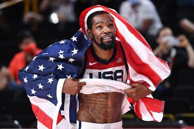 USA's Kevin Durant celebrates the gold medal after defeating France in the Men's Basketball Final at the 2020 Tokyo Olympics on Saturday, Aug. 7, 2021, in Tokyo.