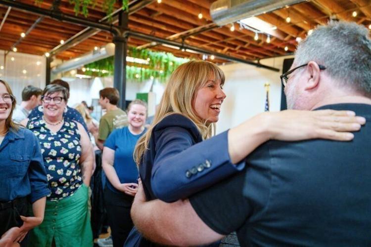 Iowa congressional candidate Sarah Trone Garriott greets supporters during an election night watch party hosted by the Iowa Democratic Party, June 2, 2026, in Des Moines.