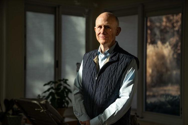 West Des Moines resident John Duesing stands for a portrait on Monday, Feb. 10, 2025. Duesing and his Hickory Ridge Estates neighbors noticed someone registered businesses at 17 home addresses last summer.