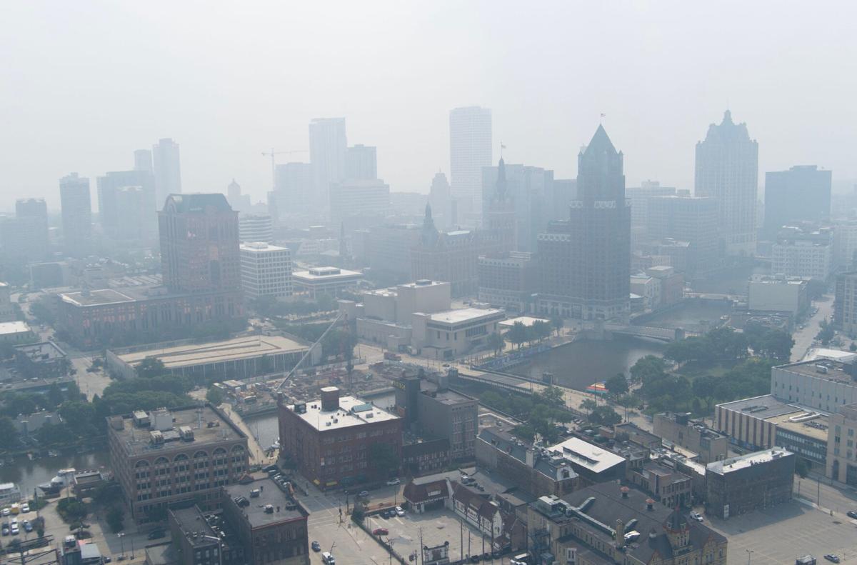 A blanket of smoke fills the air from Canadian wildfires moving south in downtown Milwaukee on July 31, 2025. The Wisconsin Department of Natural Resources issued an air quality advisory for all of the state. The smoke is expected to move back north on Aug