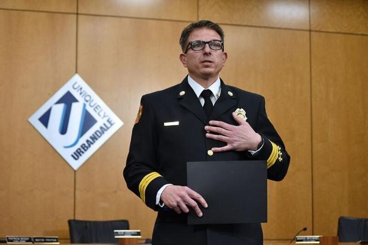 Urbandale Fire Battalion Chief Mike Gentosi addresses the crowd after receiving the Medal of Valor during a ceremony at Urbandale City Hall on April 7, 2026.