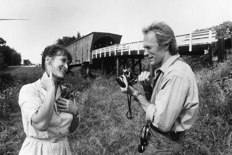 Clint Eastwood and Meryl Streep, pictured in front of the Holliwell bridge, take a break while filming "The Bridges of Madison County."