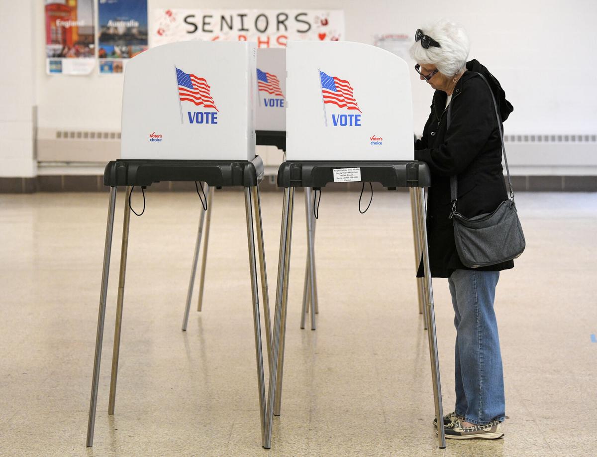 Voter Helen Wilson fills out her ballot during the Maryland Primary Election, at Glen Burnie High School on May 14, 2024, in Glen Burnie, Maryland.