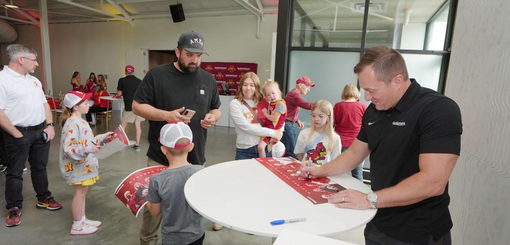 Iowa State men’s basketball head coach T.J. Otzelberger signs autograph during Cyclone Tailgate Tour at Curate on may 18, 2026,