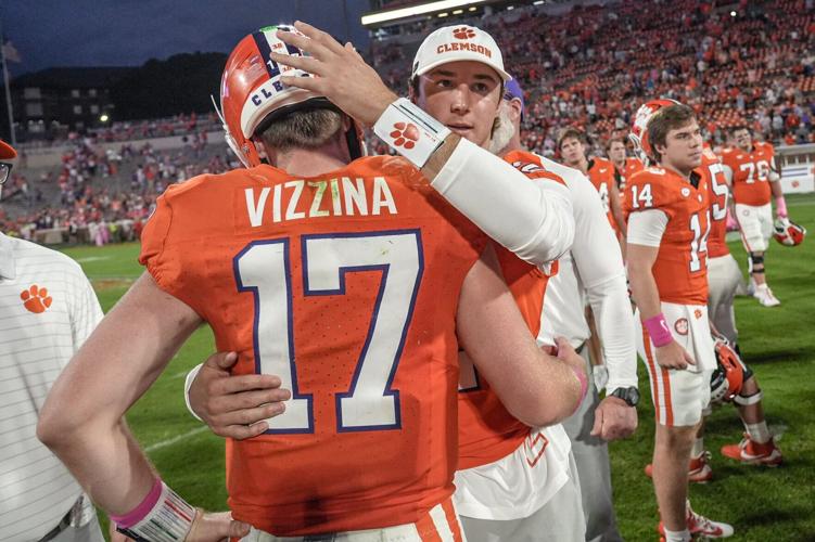 Clemson quarterback Cade Klubnik (2) consoles quarterback Christopher Vizzina (17) after the game at Memorial Stadium in Clemson, S.C. Saturday, October 18, 2025. SMU won 35-24.