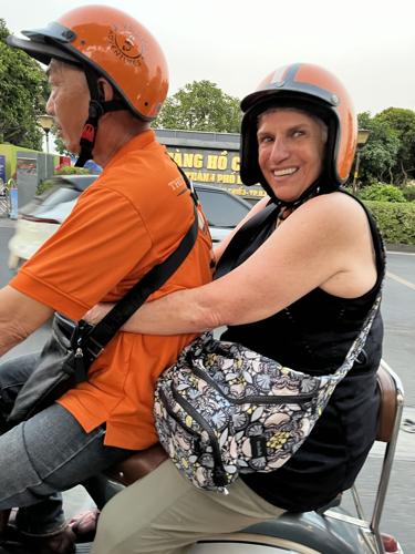 RIDING WITH VESPA ADVENTURES IN HO CHI MIHN CITY.
