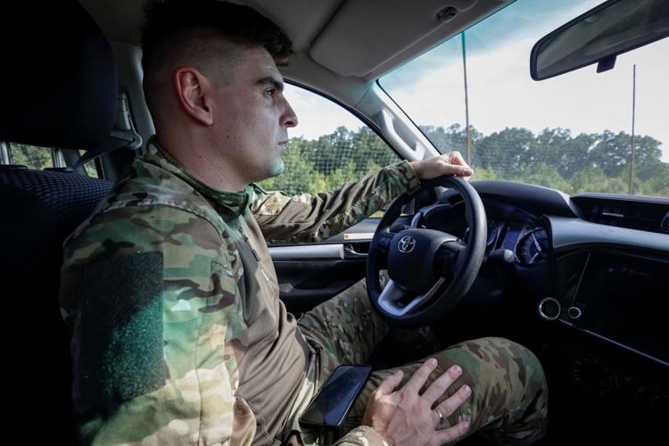 A Ukrainian commander, who rescued injured service members from UGV, and earned nation's highest military honour, drives vehicle in Kharkiv region