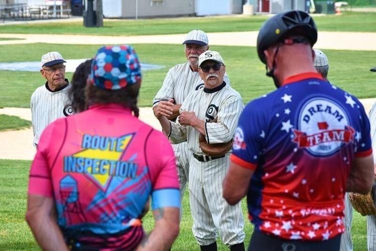 Marv Maiers, a member of the Field of Dreams Ghost Players, speaks to members of the RAGBRAI route inspection crew in Dyersville on June 6, 2026.