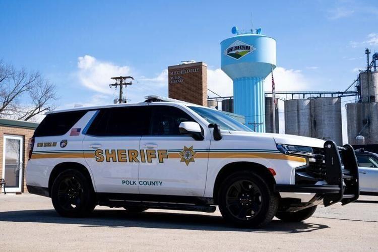 A Polk County sheriff vehicle patrols downtown Mitchellville during an afternoon shift in rural Polk County on April 10, 2026.