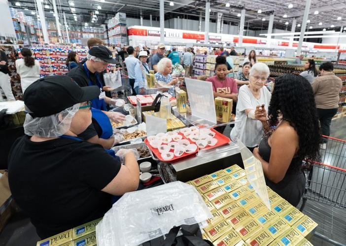 People taste samples at Costco as it opens in Pensacola, Florida on June 25, 2026.