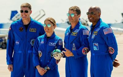 The crew of Artemis II (mission specialists Jeremy Hansen and Christina Koch, Commander Reid Wiseman and Pilot Victor Glover) pose for photos with their Zero-G Indicator named “Rise” after their arrival at Kennedy Space Center, FL March 27, 2026 They ar...