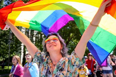 Silver Walls waves a rainbow flag as he marches in the 2025 Pride parade in Salem. (copy)