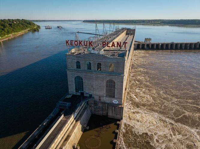 Barges enter and leave though Lock and Dam No. 19 on the Mississippi River, June 12, 2026, in Keokuk, Iowa.