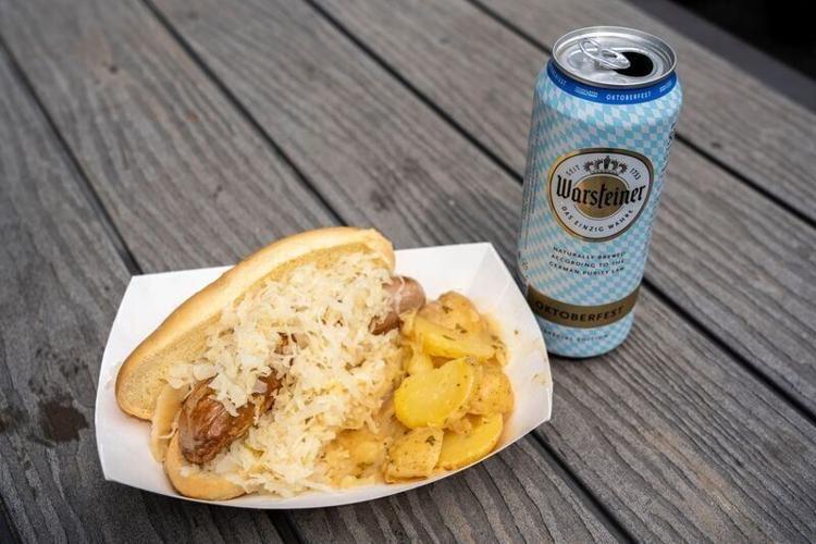 Bratwurst, sauerkraut and potato salad from German Taste is seen at World Food and Music Festival in Western Gateway Park on Friday, Aug. 23, 2024, in Des Moines.