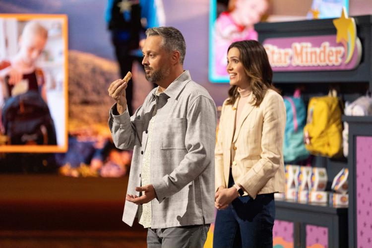 Nate (Nate Bargatze) tries to scarf down a doughnut while wife Katie (Mandy Moore) woos the "Shark Tank" crew in "The Breadwinner."