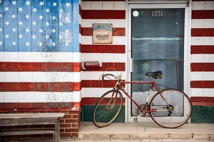 A bike sits in a storefront during Day 1 of RAGBRAI 52 on Sunday, July 20, 2025, in Hartley.