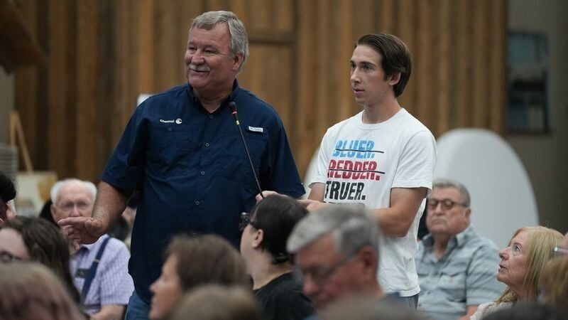 Primghar resident Kelly Nieuwenhuis asks a question to Iowa Democratic gubernatorial candidate Rob Sand during his 100 Town Hall tour on Tuesday, July 21, 2026, at Yesterday's Memories in Sanborn, Iowa.